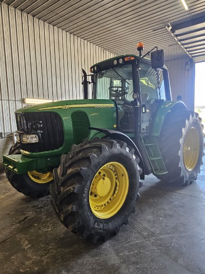 John Deere 7420 Power Quad in the yard